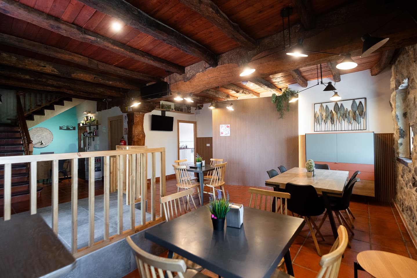 Common dining room of the rural house with tables and chairs