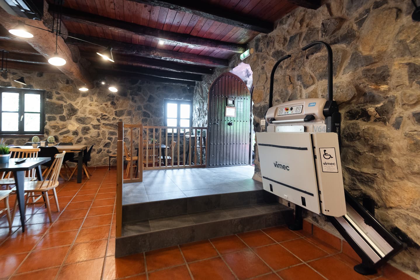 Platform for wheelchair on the stairs of the common dining room in the rural house Artola